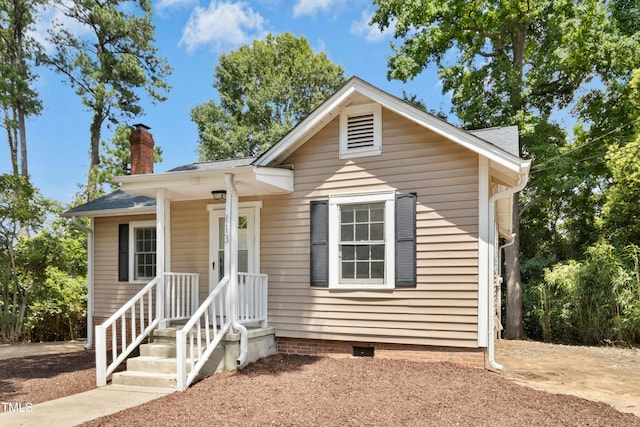 113 Herbert St, Durham, NC 27703 - view of front facade with a chimney, crawl space, and roof with shingles