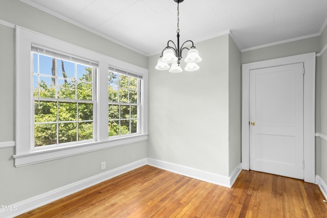 113 Herbert St, Durham, NC 27703 - unfurnished dining area with a chandelier, crown molding, and light wood-style flooring