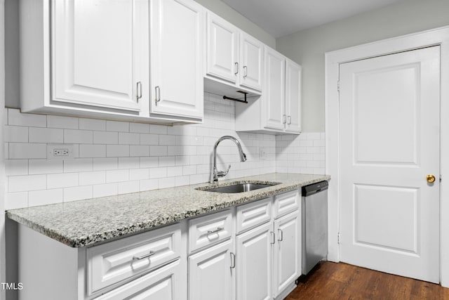 113 Herbert St, Durham, NC 27703 - kitchen with stainless steel dishwasher, white cabinetry, dark wood-style flooring, and light stone countertops
