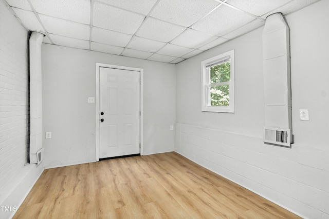 113 Herbert St, Durham, NC 27703 - empty room featuring a paneled ceiling and light wood-style floors