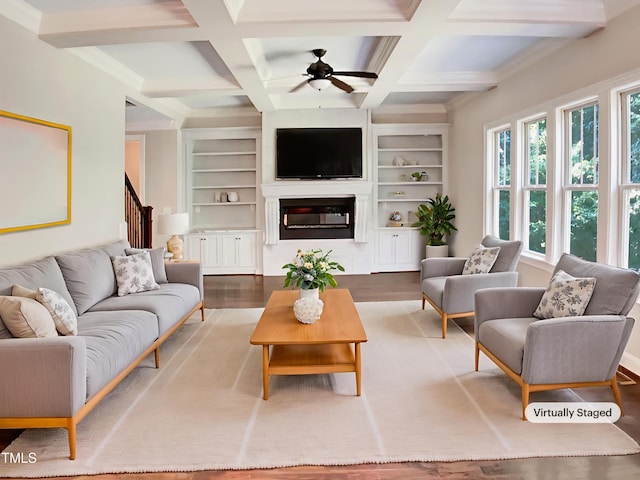 3575 Bragg Valley Ln, Wake Forest, NC 27587 - living room featuring built in shelves, a ceiling fan, wood finished floors, beamed ceiling, and coffered ceiling