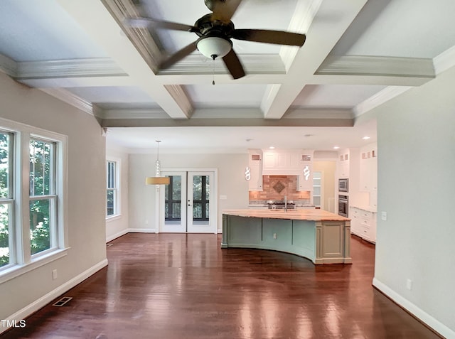 3575 Bragg Valley Ln, Wake Forest, NC 27587 - unfurnished living room with coffered ceiling, plenty of natural light, dark wood finished floors, beam ceiling, and a ceiling fan