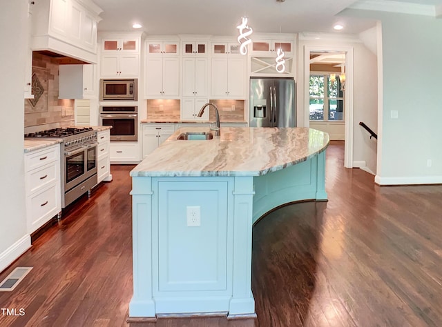 3575 Bragg Valley Ln, Wake Forest, NC 27587 - kitchen featuring appliances with stainless steel finishes, recessed lighting, dark wood-style flooring, decorative backsplash, and crown molding