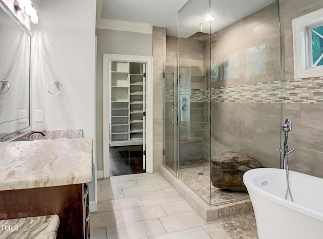 3575 Bragg Valley Ln, Wake Forest, NC 27587 - full bath with a stall shower, vanity, a freestanding bath, and a walk in closet