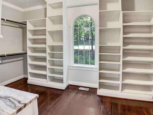3575 Bragg Valley Ln, Wake Forest, NC 27587 - walk in closet with dark wood-type flooring