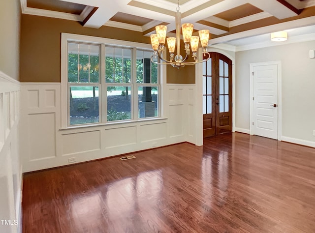 3575 Bragg Valley Ln, Wake Forest, NC 27587 - unfurnished dining area with a decorative wall, coffered ceiling, ornamental molding, a chandelier, and plenty of natural light