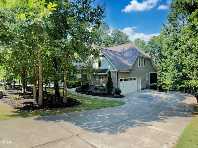 3575 Bragg Valley Ln, Wake Forest, NC 27587 - view of front of house featuring driveway, a garage, and roof with shingles