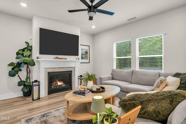 403 Sustainable Way, Raleigh, NC 27610 - living area with a ceiling fan, wood finished floors, a glass covered fireplace, and recessed lighting