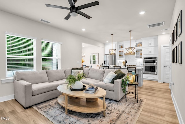 403 Sustainable Way, Raleigh, NC 27610 - living room featuring ceiling fan, light wood-style flooring, and recessed lighting