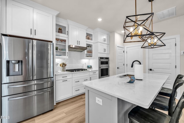 403 Sustainable Way, Raleigh, NC 27610 - kitchen featuring stainless steel appliances, a chandelier, light wood-style floors, white cabinetry, and recessed lighting