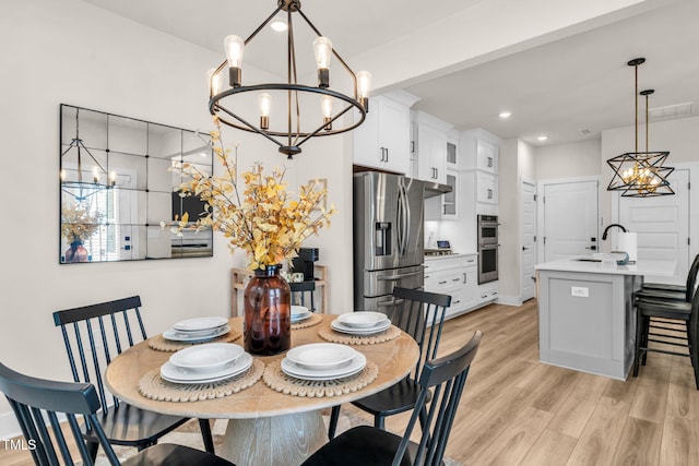 403 Sustainable Way, Raleigh, NC 27610 - dining space featuring a chandelier, light wood-type flooring, and recessed lighting