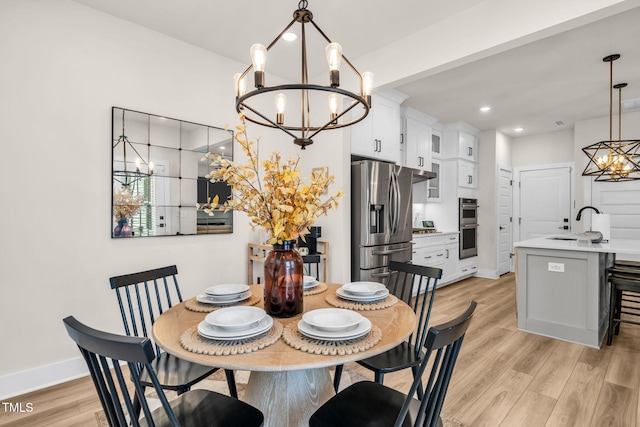 403 Sustainable Way, Raleigh, NC 27610 - dining space with a chandelier, light wood-type flooring, and recessed lighting