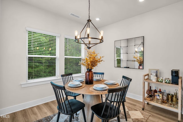 403 Sustainable Way, Raleigh, NC 27610 - dining space featuring a chandelier, wood finished floors, and recessed lighting
