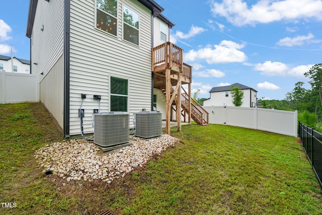 403 Sustainable Way, Raleigh, NC 27610 - back of property with a fenced backyard, stairway, and a wooden deck