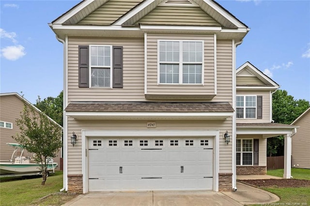 4041 Lifestyle Rd, Fayetteville, NC 28312 - view of front of property with a garage, driveway, and stone siding