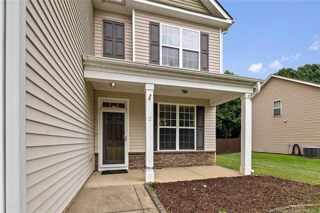 4041 Lifestyle Rd, Fayetteville, NC 28312 - view of exterior entry featuring a porch and stone siding