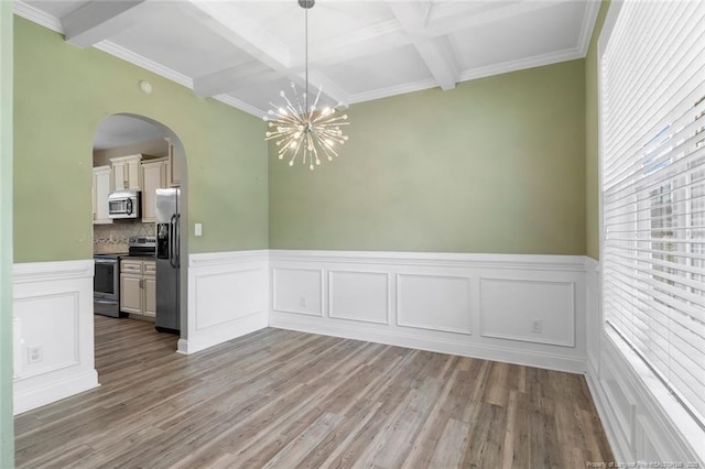 4041 Lifestyle Rd, Fayetteville, NC 28312 - unfurnished dining area featuring coffered ceiling, beam ceiling, arched walkways, wood finished floors, and a chandelier