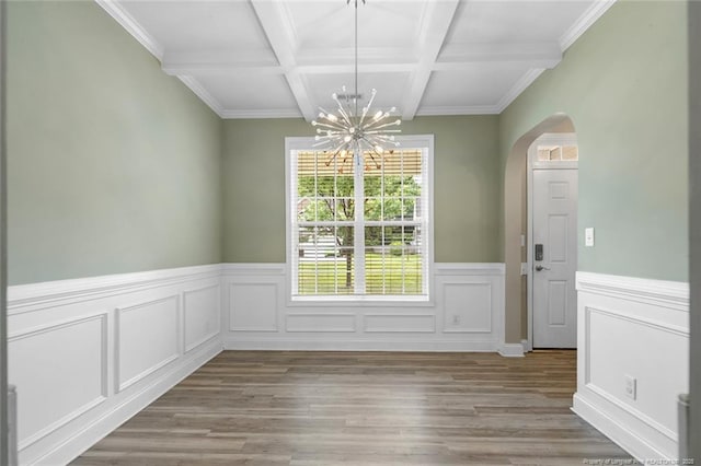 4041 Lifestyle Rd, Fayetteville, NC 28312 - unfurnished dining area featuring arched walkways, a chandelier, beamed ceiling, light wood-style flooring, and a wainscoted wall