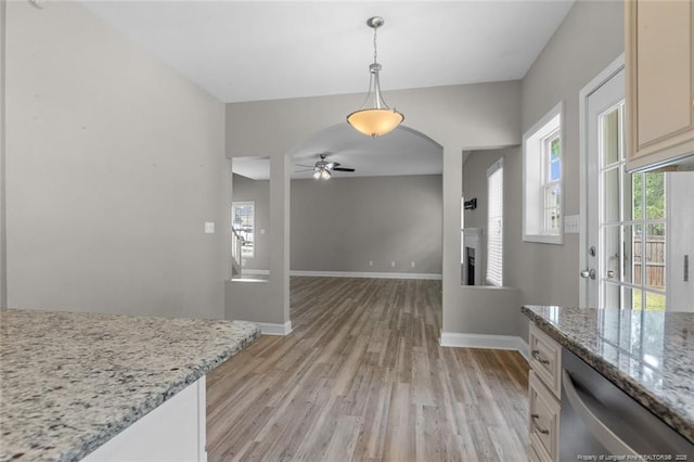 4041 Lifestyle Rd, Fayetteville, NC 28312 - dining area featuring a ceiling fan, light wood-type flooring, and a fireplace