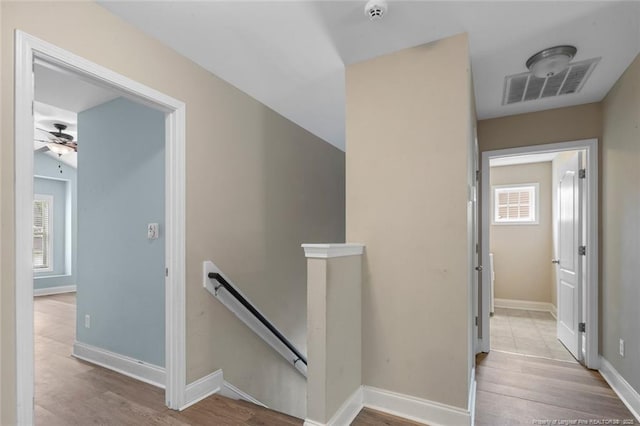 4041 Lifestyle Rd, Fayetteville, NC 28312 - hallway featuring an upstairs landing and wood finished floors