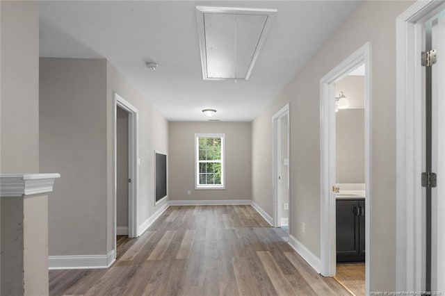 4041 Lifestyle Rd, Fayetteville, NC 28312 - hall featuring attic access and wood finished floors