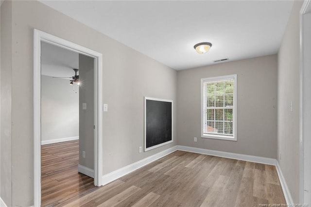 4041 Lifestyle Rd, Fayetteville, NC 28312 - spare room with wood finished floors and a ceiling fan