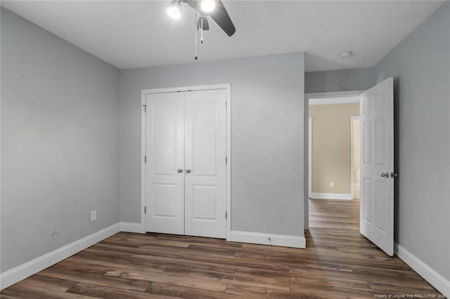 4041 Lifestyle Rd, Fayetteville, NC 28312 - unfurnished bedroom with a closet, dark wood-style flooring, and a ceiling fan