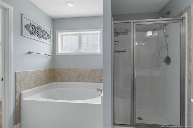 4041 Lifestyle Rd, Fayetteville, NC 28312 - bathroom with a garden tub and a shower stall