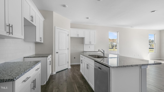 824 Old Tarboro Rd, Wendell, NC 27591 - kitchen with dishwasher, stone counters, backsplash, and dark wood-style flooring