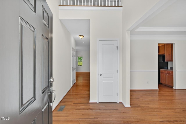 4518 Coral Dr, Durham, NC 27713 - entryway featuring light wood-type flooring and ornamental molding