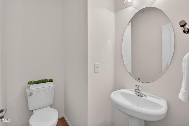 4518 Coral Dr, Durham, NC 27713 - bathroom featuring toilet and a sink