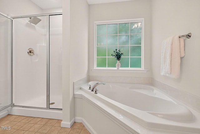 4518 Coral Dr, Durham, NC 27713 - bathroom featuring a stall shower, a garden tub, and tile patterned flooring