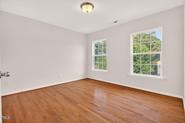 4518 Coral Dr, Durham, NC 27713 - unfurnished room with healthy amount of natural light and wood finished floors