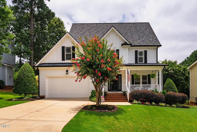 7269 Bedford Ridge Dr, Apex, NC 27539 - view of front facade with board and batten siding, covered porch, a front lawn, and driveway