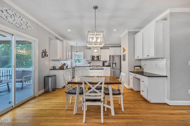 7269 Bedford Ridge Dr, Apex, NC 27539 - dining space with a chandelier, ornamental molding, light wood-style floors, and recessed lighting
