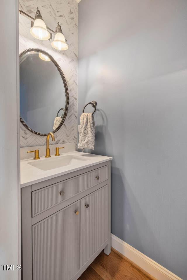 7269 Bedford Ridge Dr, Apex, NC 27539 - bathroom with vanity and wood finished floors