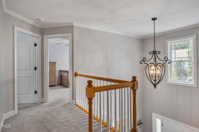 7269 Bedford Ridge Dr, Apex, NC 27539 - corridor featuring a chandelier, an upstairs landing, carpet, and ornamental molding