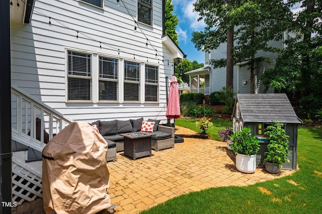 7269 Bedford Ridge Dr, Apex, NC 27539 - view of patio featuring an outdoor living space with a fire pit and a storage shed