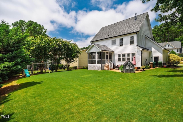 7269 Bedford Ridge Dr, Apex, NC 27539 - rear view of property featuring a sunroom, a playground, and a shingled roof