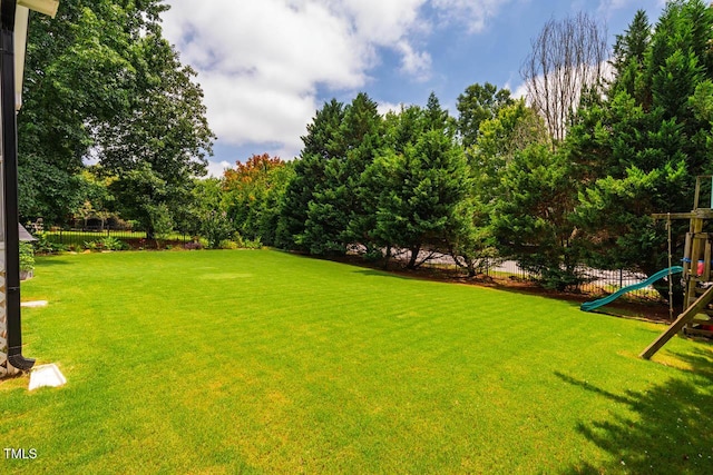 7269 Bedford Ridge Dr, Apex, NC 27539 - view of yard featuring a playground and view of scattered trees