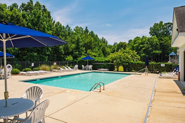 7269 Bedford Ridge Dr, Apex, NC 27539 - community pool featuring a patio and view of scattered trees