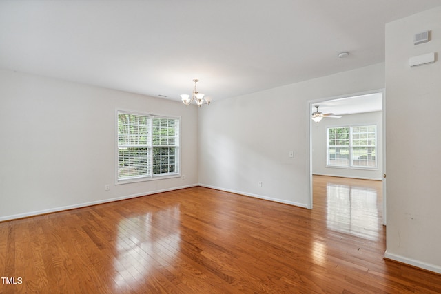2228 Cedar Grove Dr, Durham, NC 27703 - empty room featuring a chandelier, wood finished floors, and a ceiling fan