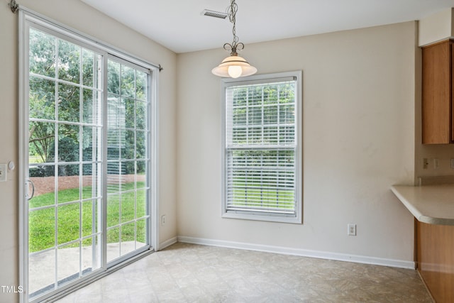 2228 Cedar Grove Dr, Durham, NC 27703 - unfurnished dining area featuring healthy amount of natural light