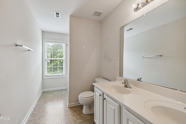 2228 Cedar Grove Dr, Durham, NC 27703 - full bath featuring toilet and double vanity