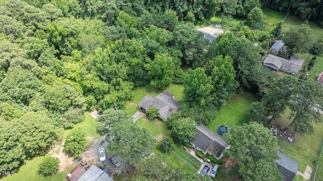 2701 Garfield St, Raleigh, NC 27603 - aerial view of property and surrounding area featuring a heavily wooded area