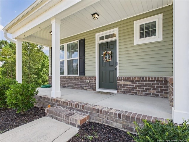 448 Pittfield Run, Cameron, NC 28326 - property entrance with covered porch and brick siding
