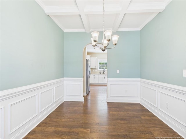 448 Pittfield Run, Cameron, NC 28326 - unfurnished dining area featuring a chandelier, arched walkways, beam ceiling, wainscoting, and coffered ceiling