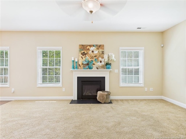 448 Pittfield Run, Cameron, NC 28326 - unfurnished living room with carpet, ceiling fan, and a fireplace with flush hearth
