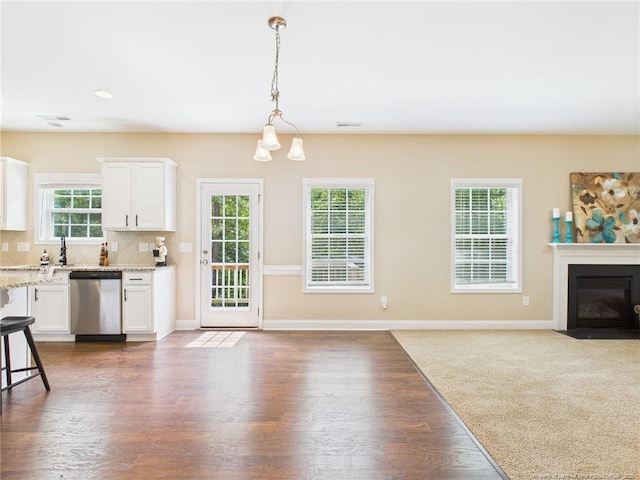 448 Pittfield Run, Cameron, NC 28326 - kitchen with dishwasher, white cabinets, hanging light fixtures, open floor plan, and light stone countertops