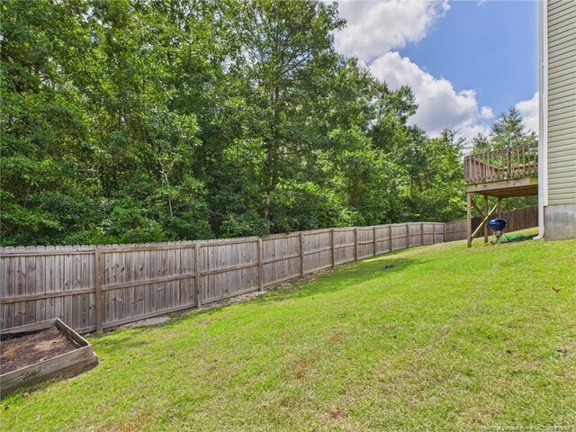 448 Pittfield Run, Cameron, NC 28326 - fenced backyard featuring a wooden deck